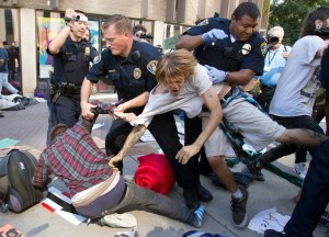 OccupySD protesters being arrested for refusing to take down tents at the San Diego Civic Center (AP Photo/ Gregory Bull)